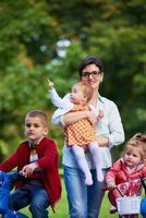 modern mother portrait  with kids in park photo