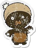 retro distressed sticker of a cartoon cute teddy bear in hat vector