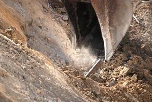 Bulldozer breaking ground photo