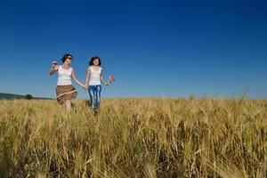 happy couple in wheat field photo