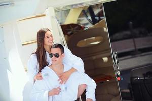 young couple on yacht photo