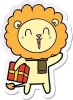 sticker of a laughing lion cartoon with christmas present vector