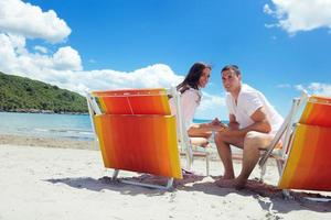 happy couple have fun on the beach photo