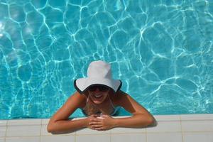 Happy woman in swimming pool photo
