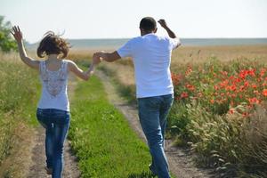 happy couple in wheat field photo