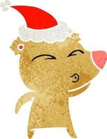 retro cartoon of a whistling bear wearing santa hat vector