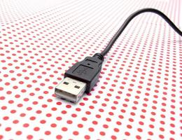 USB cable on dotted background photo