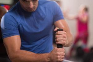 young man after workout with hammer and tractor tire photo