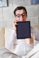 woman using tablet pc at home photo