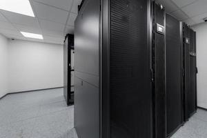 Data Center With Multiple Rows of Fully Operational Server Racks. Modern Telecommunications, Cloud Computing, Artificial Intelligence, Database, Supercomputer Technology Concept. photo