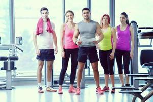 Group of people exercising at the gym photo