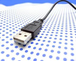 USB cable on dotted background photo