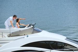 young couple on yacht photo