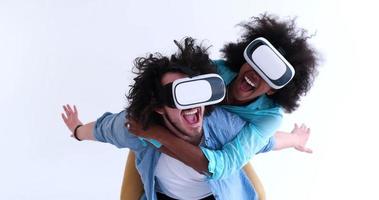 multiethnic couple getting experience using VR headset glasses photo