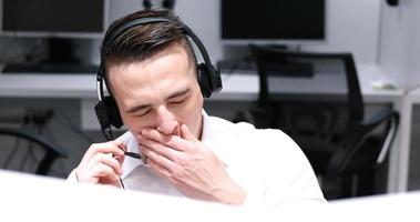 male call centre operator doing his job photo