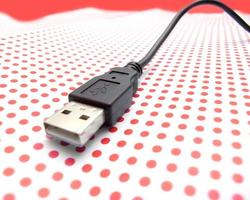 USB cable on dotted background photo