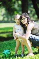 happy children and mom have fun at park photo