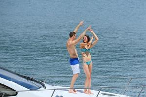 young couple on yacht photo