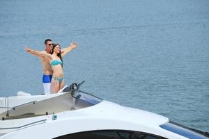 young couple on yacht photo