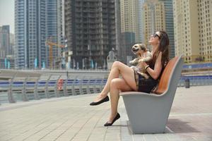 happy young woman with puppy have fun photo