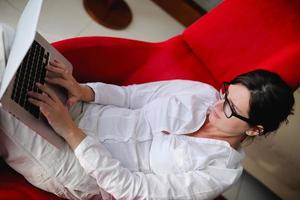 woman using a laptop computer at home photo