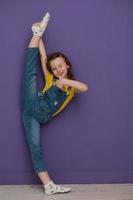 Cute little girl dancing at home photo