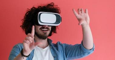 young man using VR headset glasses of virtual reality photo