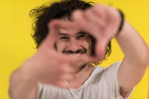 young man with funny hair over color background photo