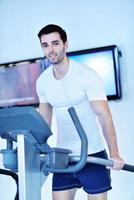 man running on the treadmill photo