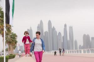 mother and cute little girl on the promenade photo