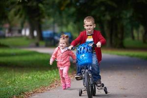 boy and girl with bicycle photo