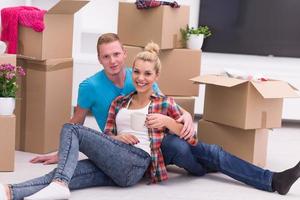 young couple moving  in new house photo