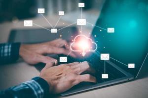 Hand using laptop with cloud computing and Email online storage concept,  Cloud Computing Technology Internet Storage Network Concept And a large database big data Through internet technology, photo