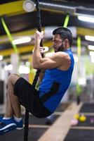 man doing rope climbing photo