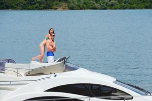 young couple on yacht photo