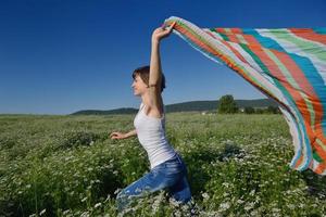 young woman in wheat field at summer photo