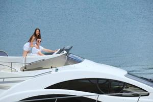 young couple on yacht photo