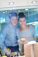 happy young couple in jewelry store photo