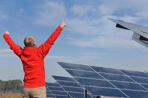 Male solar panel engineer at work place photo