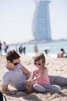 Mom and daughter on the beach photo