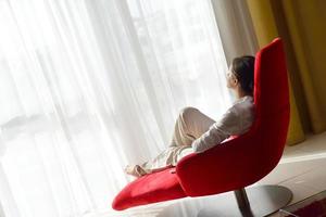 happy young woman relax at home on sofa photo