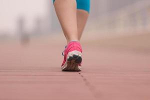 woman running on the promenade photo