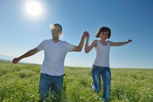 happy couple in wheat field photo