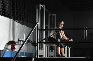 young woman practicing fitness and working out photo