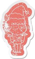 cartoon distressed sticker of a curious boy shrugging shoulders wearing santa hat vector