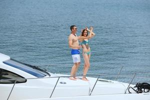 young couple on yacht photo