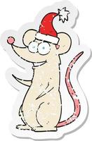 retro distressed sticker of a cartoon mouse wearing christmas hat vector