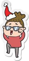 sticker cartoon of a happy woman wearing spectacles wearing santa hat vector