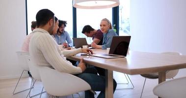 Startup Business Team At A Meeting at modern office building photo