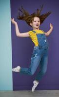 Cute little girl dancing at home photo